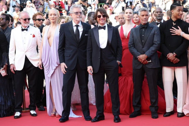 CANNES, FRANCE - MAY 14: Erik Jendresen, Pom Klementieff, Christopher McQuarrie, Joel Bervell, Tom Cruise, Hayley Atwell, Esai Morales and Greg Tarzan Davis attend the "Mission Impossible - The Final Reckoning" red carpet at the 78th annual Cannes Film Festival at Palais des Festivals on May 14, 2025 in Cannes, France. (Photo by Daniele Venturelli/WireImage)