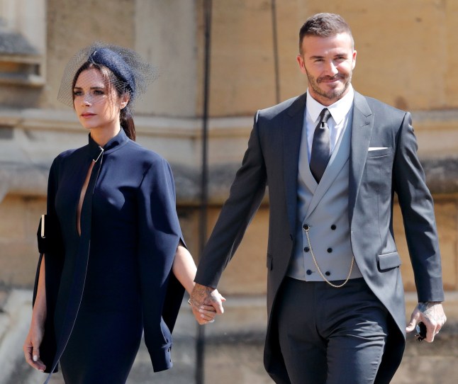 WINDSOR, UNITED KINGDOM - MAY 19: (EMBARGOED FOR PUBLICATION IN UK NEWSPAPERS UNTIL 24 HOURS AFTER CREATE DATE AND TIME) Victoria Beckham and David Beckham attend the wedding of Prince Harry to Ms Meghan Markle at St George's Chapel, Windsor Castle on May 19, 2018 in Windsor, England. Prince Henry Charles Albert David of Wales marries Ms. Meghan Markle in a service at St George's Chapel inside the grounds of Windsor Castle. Among the guests were 2200 members of the public, the royal family and Ms. Markle's Mother Doria Ragland. (Photo by Max Mumby/Indigo/Getty Images)